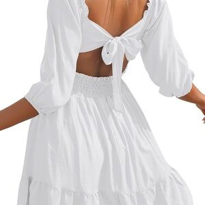 Flowy white bow tie back dress perfect for wedding rehearsal